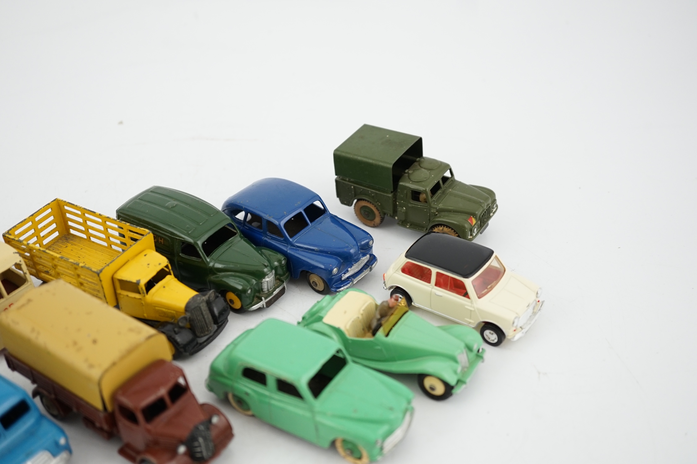 Twelve Dinky Toys, including; Austin van, Vanguard, Market Gardener’s wagon, Hillman Minx, MG Midget, Bedford van, etc.